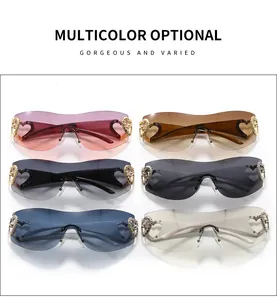 Display of multicolor Y2K rimless sunglasses featuring decorative heart-shaped metal hinges