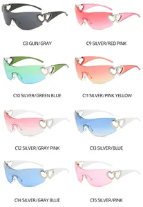 Multi-color Y2K rimless sunglasses with heart-shaped cutout detail and gradient lenses.