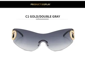 Detail view of Y2K rimless sunglasses featuring gold heart accents and gradient gray lens