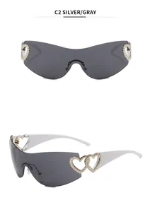 Detail view of Y2K rimless sunglasses featuring unique silver heart-shaped cutout temple accents