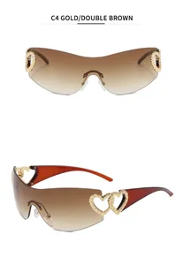 Detail view of Y2K rimless sunglasses featuring golden heart-shaped hollow-out temples.