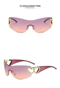 Macro detail of Y2K rimless sunglasses with gold hollow heart hinges and purple gradient lenses