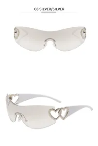 Stylish Y2K rimless sunglasses with hollow heart hinges and silver gradient lenses.