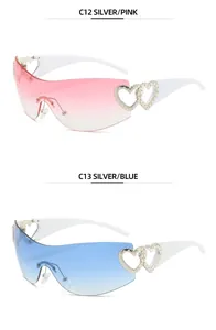 Stylish Y2K rimless sunglasses with hollow heart temple detail in pink and blue gradient
