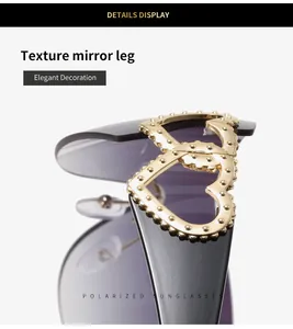 Close-up of Y2K rimless sunglasses with gold heart detail on textured legs.