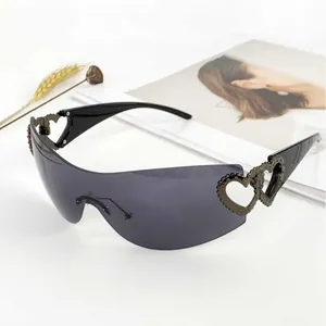 Stylish Y2K rimless wrap sunglasses for women with unique hollow heart temple detail
