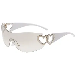 Trendy Y2K rimless shield sunglasses for women with heart hollow-out design and white temples