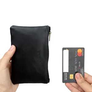 Portable black PU leather tobacco pouch shown with a card for size comparison