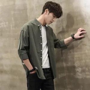 Urban style casual dark green long sleeve shirt for men shown in high quality lifestyle detail