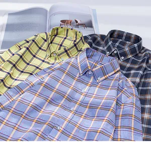 Detail view of men's plaid oxford cotton long-sleeve shirts in multi-color layers.