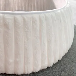 Macro view of plush white vertical ribbed texture on Christmas tree collar skirt
