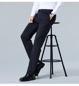 Close-up detail of men's slim fit straight-leg non-iron business trousers in deep navy color
