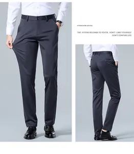 Detail view of charcoal grey men's stretch dress pants showing fit and fabric elasticity.