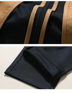 Detailed close-up showing hem construction and piping on men's non-iron suit pants.