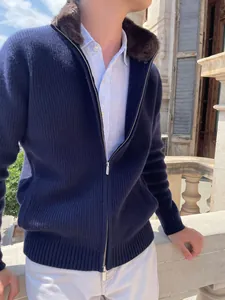 Close-up of men's navy ribbed cardigan featuring a warm brown faux fur collar detail
