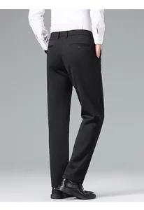 Rear perspective of slim fit black formal trousers for men featuring back pocket detail