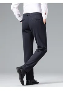 Back view of professional slim fit navy business trousers showing rear pocket details