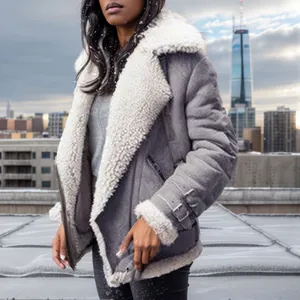 Side view of a grey suede shearling jacket with white fuzzy collar and buckle cuffs
