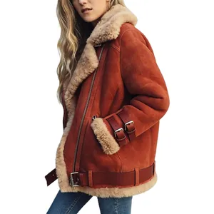 Detailed side view of a rust suede shearling jacket with faux fur lining and buckles