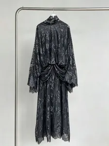 Elegant black floral lace maxi dress with high collar and bell sleeves detail view.