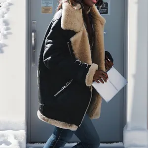 Oversized black faux shearling aviator jacket for women with warm tan faux fur lining.