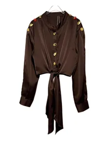 Elegant dark brown satin long sleeve blouse featuring ornate gold buttons and waist-tie design