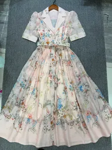 Detail of French style floral print dress with lapel collar and matching belt