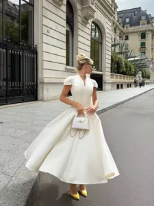 Elegant white V-neck petal sleeve pleated midi dress in premium satin acetate finish
