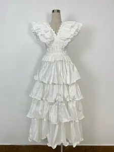 Elegant white multi-layered pleated tiered ruffle banquet dress displayed on mannequin