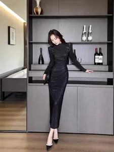 Elegant black pleated long dress with mock neck and shoulder sequin detail