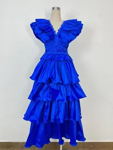 Detail view of luxury royal blue pleated tiered ruffle banquet evening gown on mannequin