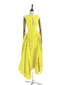 Elegant bright yellow sleeveless cutout pleated maxi dress with irregular hemline for women