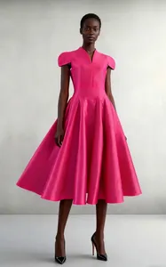 Detailed view of the magenta pleated satin fabric on a V-neck ball gown dress