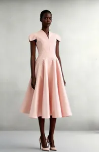 Detail view showing the elegant V-neck and petal sleeve design of pink acetate dress
