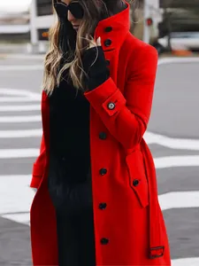 Detailed side view of a vibrant red slim-fit wool coat featuring elegant black buttons