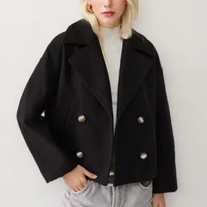 Manteau court élégant en laine noire pour femme avec double boutonnage et col à revers