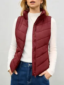 Close-up view of a women's burgundy puffer vest featuring a stand collar and zipper.