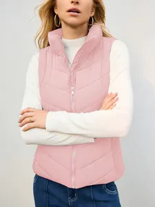 Detailed view of a women's pink quilted puffer vest featuring a cozy stand-up collar