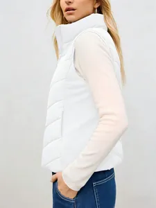 Professional side view of a white quilted stand-up collar padded vest for women