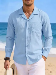 Detail view of a light blue men's linen shirt styled for summer beach vacation