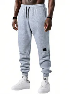 Pantalones de chándal de forro polar gris ajustados para hombre con puños de canalé
