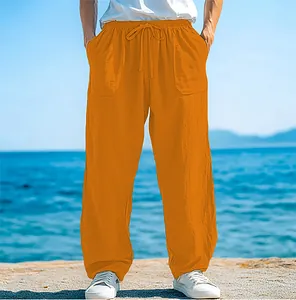 Stylish men's loose drawstring beach pants in vibrant orange featuring side pockets