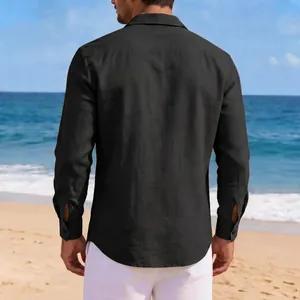 Detailed back view of a black men's casual linen long sleeve shirt at the beach