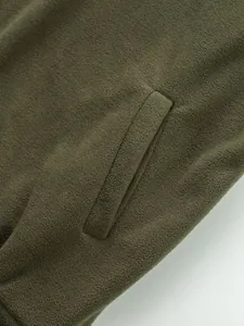 Macro view showing the soft fleece texture and side pocket detail of the olive green sweatshirt