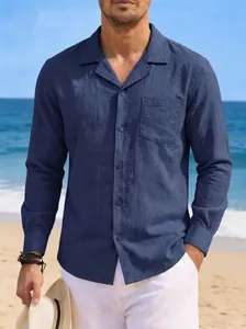 Close-up view of a men's navy blue long-sleeved cotton linen shirt in beach setting