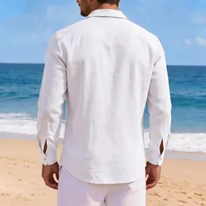 Back view of a men's vintage white cotton linen leisure shirt on a beach