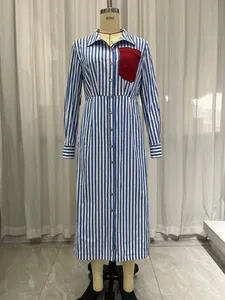 Elegant blue and white vertical striped shirt dress with a red contrast chest pocket