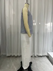 Side view of French style blue and white striped vest and white wide-leg pants set