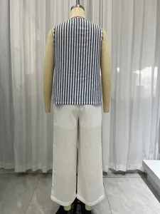 Back view of a casual blue and white striped vest paired with white linen wide-leg pants