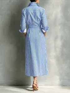 Back view of a French style blue and white striped shirt dress with a midi length.